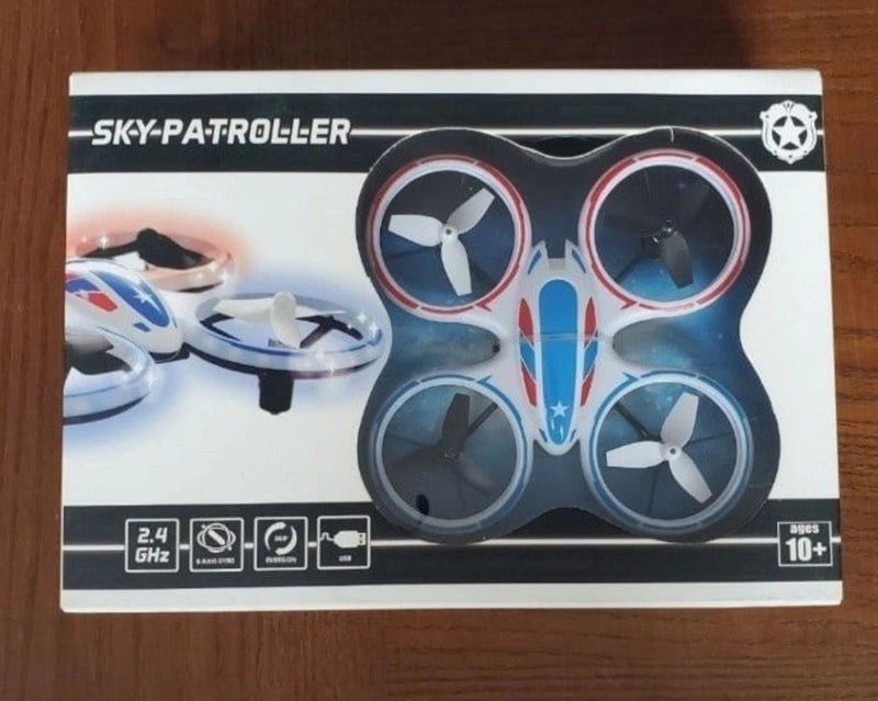 Mini RC toy drone in blue and white with four propellers and LED lights