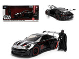 1:24 black sports car model with red wheels and Darth Vader action figure