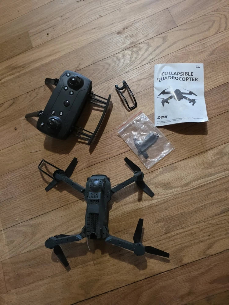 Collapsible quadrocopter drone with four propellers and attached electronics, parts included.