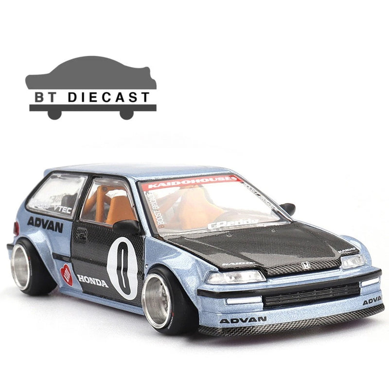 Light blue and black die-cast race car model with front grille and number 9 decals