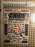 Die-cut decal sheet with EXIDE branding and sponsor logos, multi-color