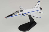 Hobby Master 1/72 T-38A Talon model airplane with white fuselage and blue stripes on stand