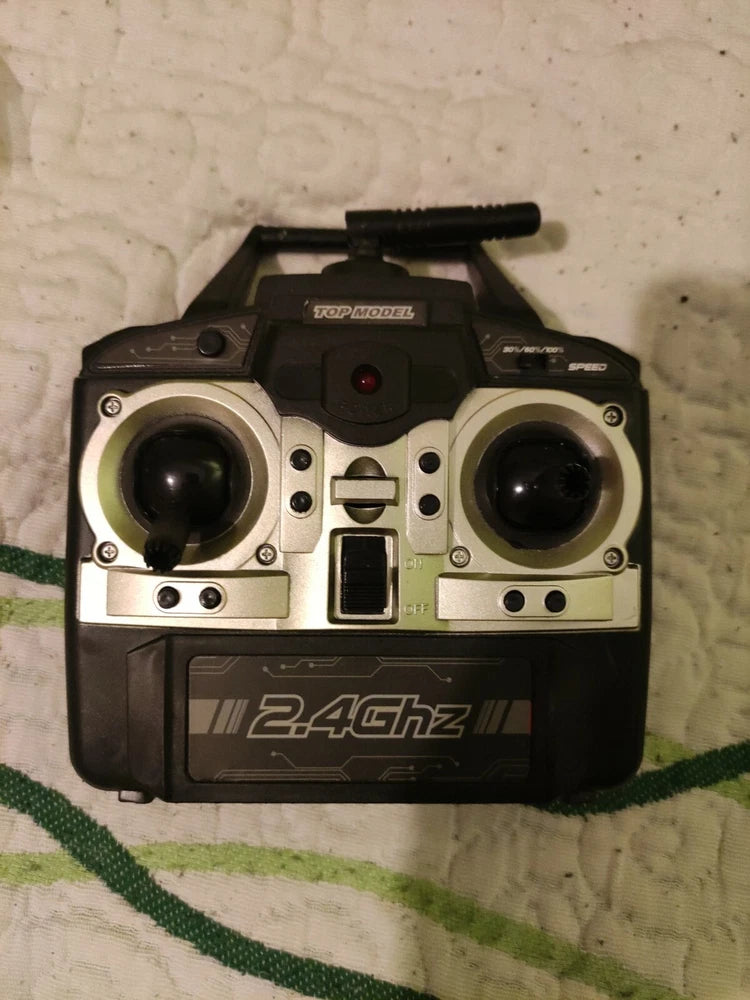 Drone remote controller, dark casing, central screen, and two front control modules