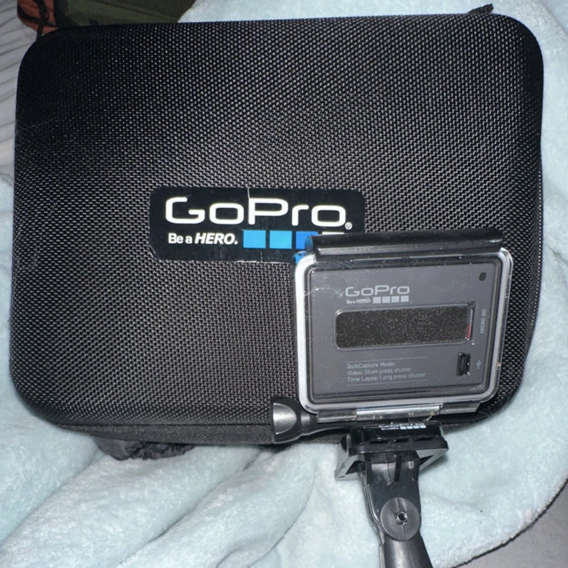 GoPro action camera in black protective case with clear front housing