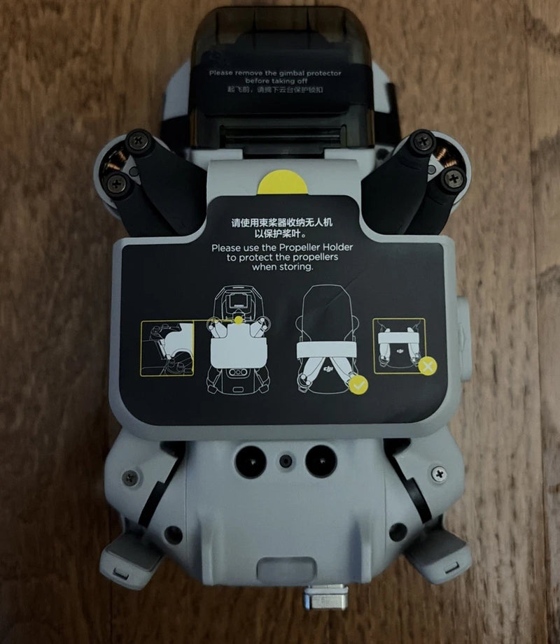 DJI Mini 2 drone with propellers and gimbal cover, front view