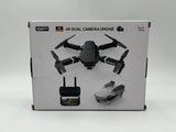 Foldable quadcopter drone with 4K dual camera, shown with remote controller in box