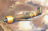 1:48 scale military aircraft model kit, painted green and tan fighter plane in flight