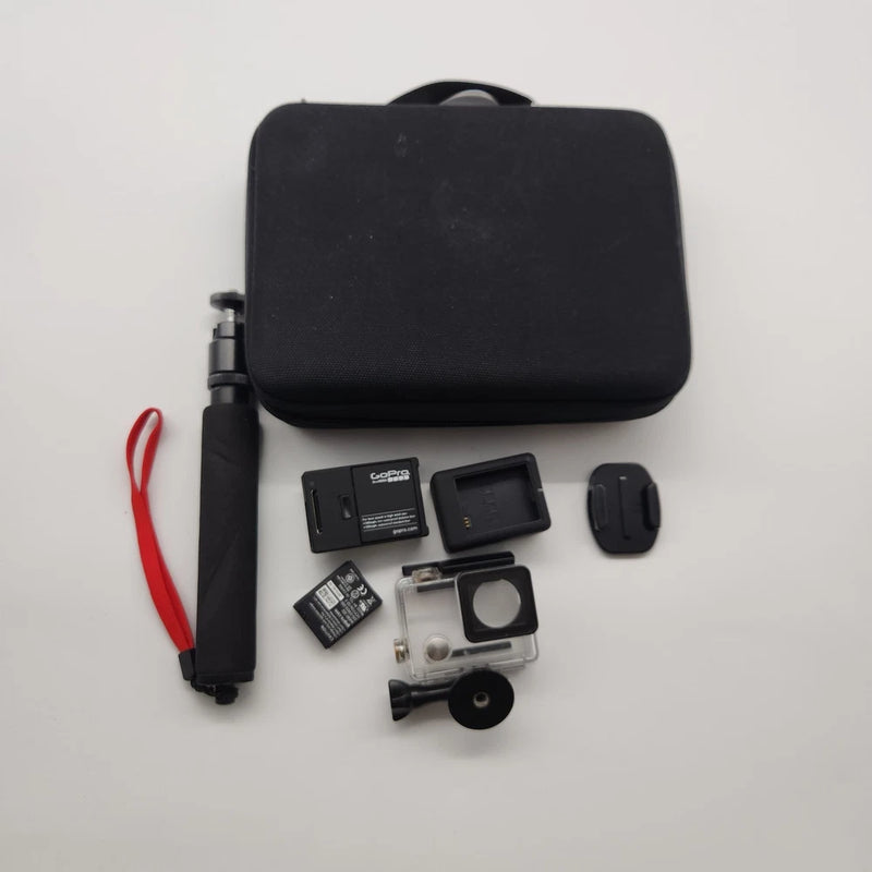 GoPro action camera kit with black carrying case, mounts, battery, and accessories
