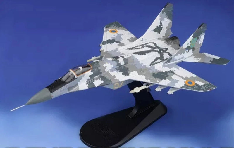 Grey and white camo MiG-29 model jet with display stand