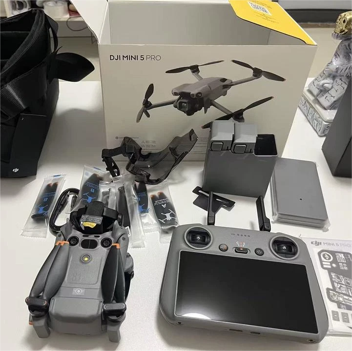DJI Mini 5 Pro drone set with remote controller and tablet-style screen