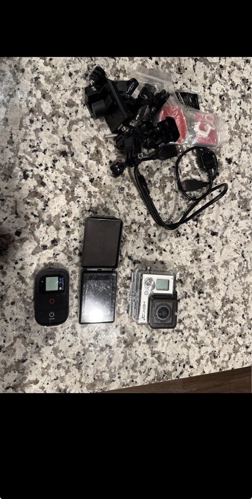 Silver action camera bundle with mounts and two cameras