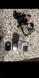 Silver action camera bundle with mounts and two cameras
