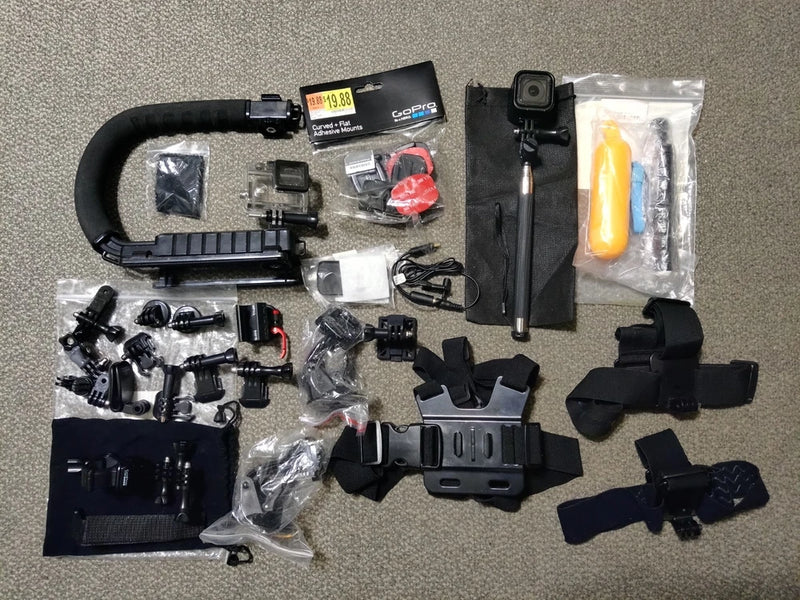 GoPro HERO4 Session action camera bundle with mounts, straps, and waterproof case, black