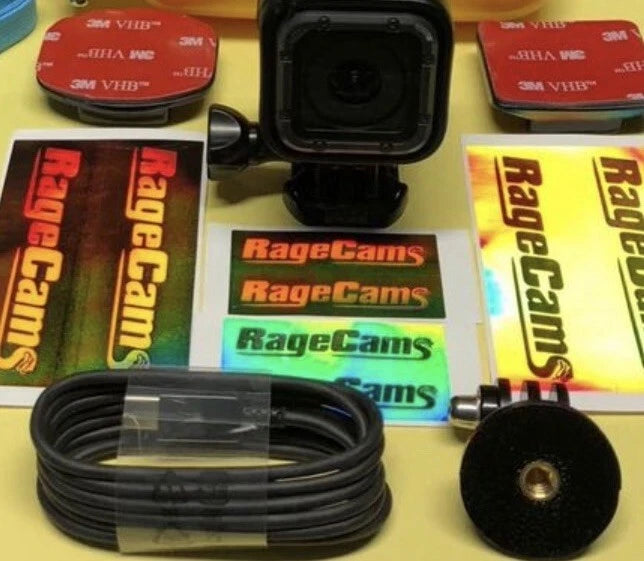 Helmet action camera kit with waterproof housing, mounts, and cable