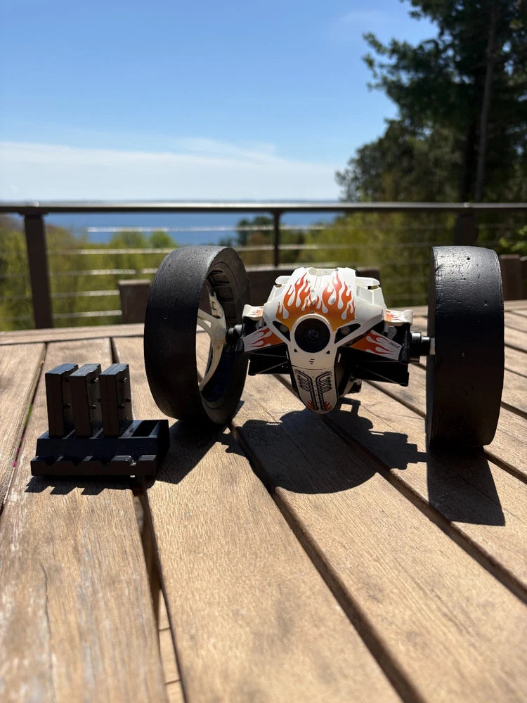 Mini RC jumping sumo drone with camera, black wheels and white flame body
