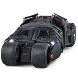 Black metal diecast toy model car with glowing headlights and textured tires