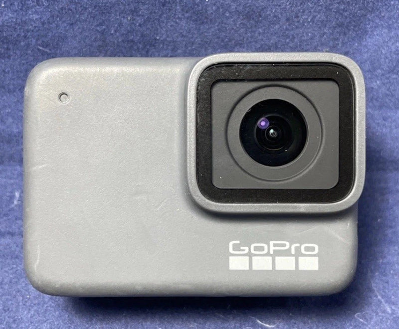 Silver waterproof action camera with front lens and GoPro logo