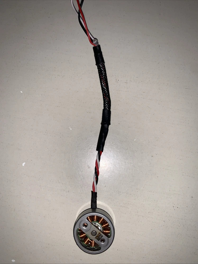 DJI drone arm motor with red/black wire, circular connector