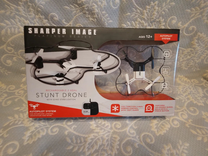 Sharper Image stunt drone box showing two white quadcopters with controller