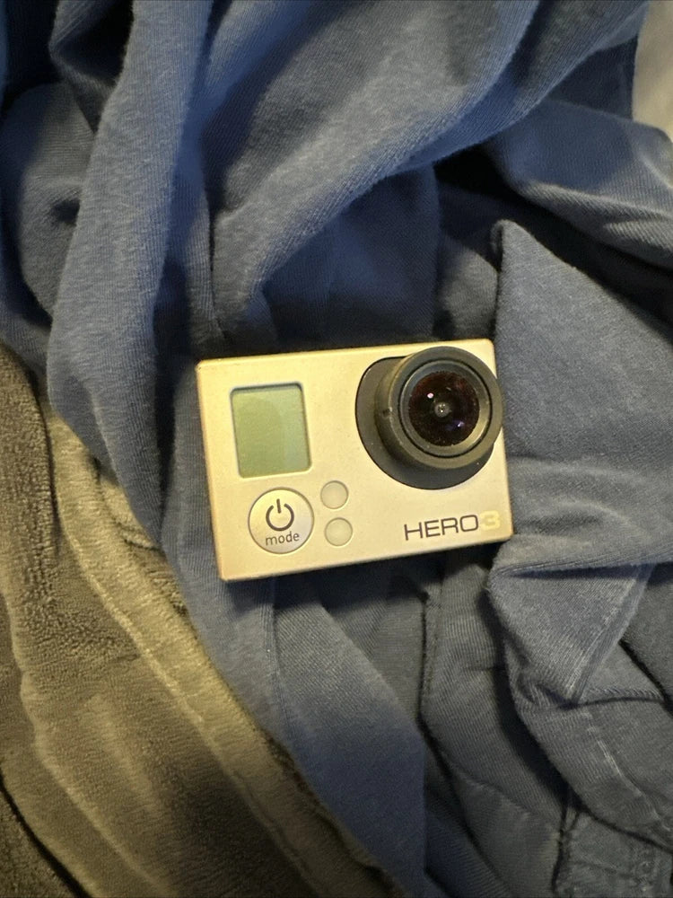 GoPro HERO3 action camera in dark housing with LCD screen and lens, surf edition