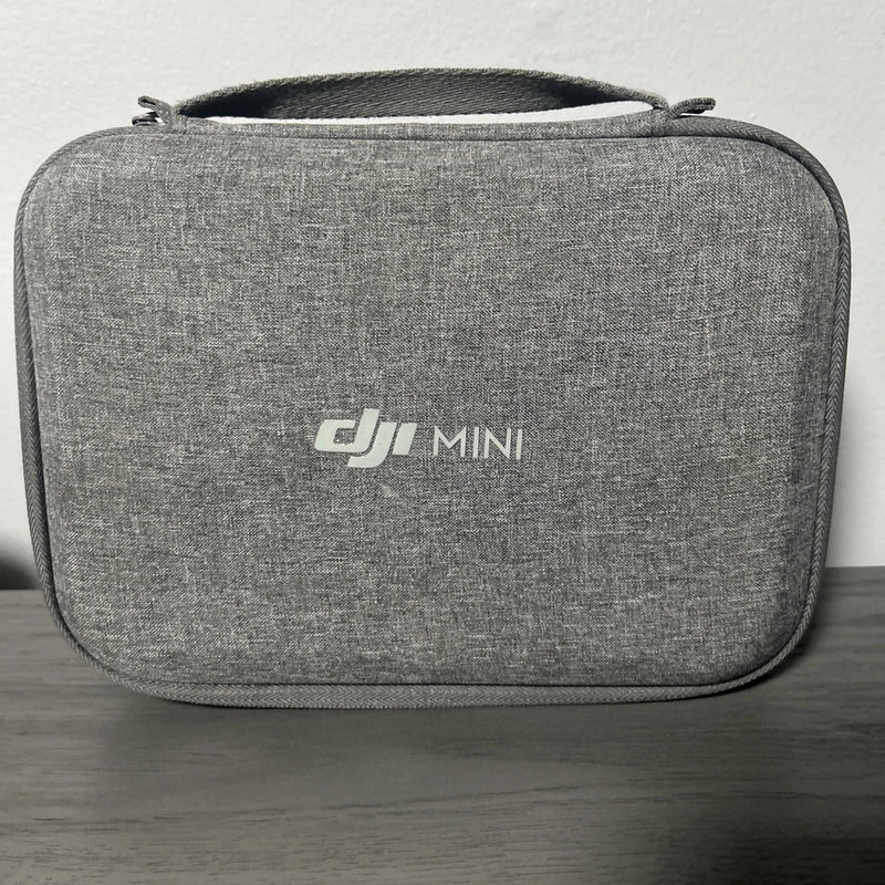 Gray DJI Mini travel case with zipper and front DJI MINI logo