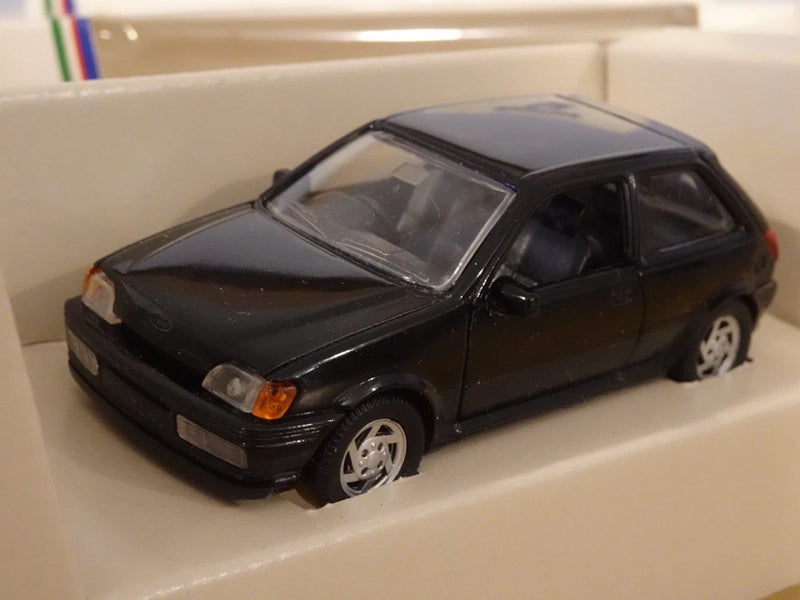 Black Ford Fiesta MK3 XR2i die-cast car model, front-left view, 1:43 scale