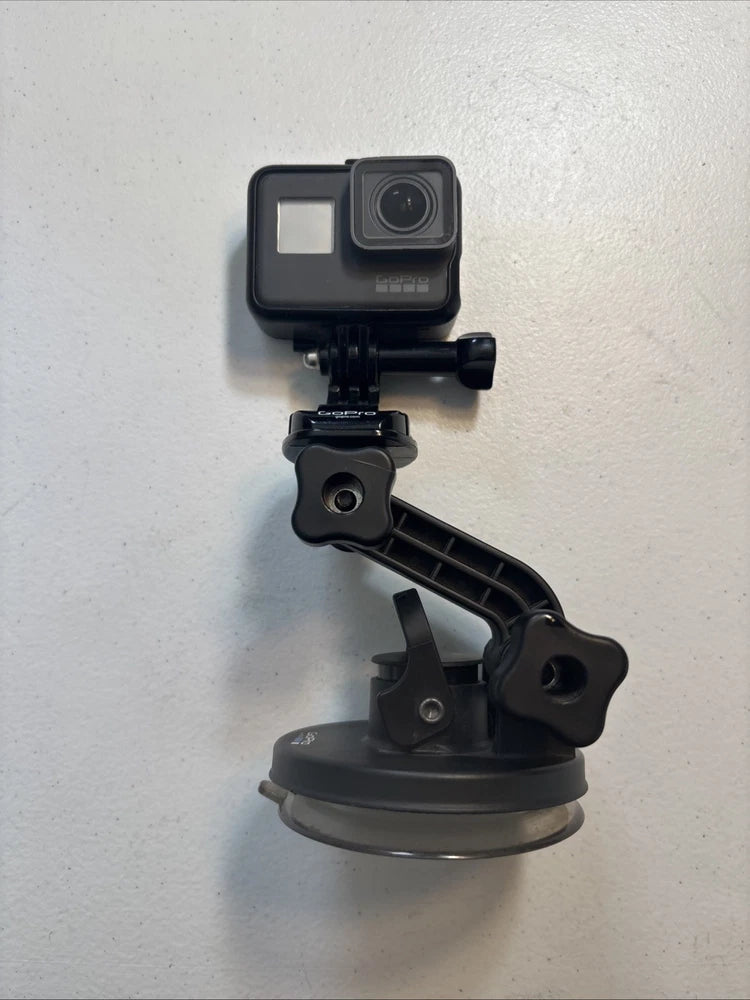 GoPro Hero5 Black Edition action camera on suction mount with handle