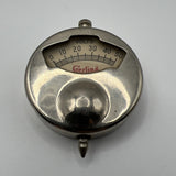 Metal volt battery tester gauge with circular scale marked 0–50 volts and central socket