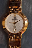 Vintage Givenchy Paris women's gold-tone round watch with Roman numeral dial and link bracelet