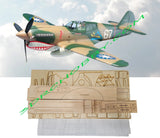 RC warbird model airplane kit with laser-cut balsa and plywood parts, wood sheets