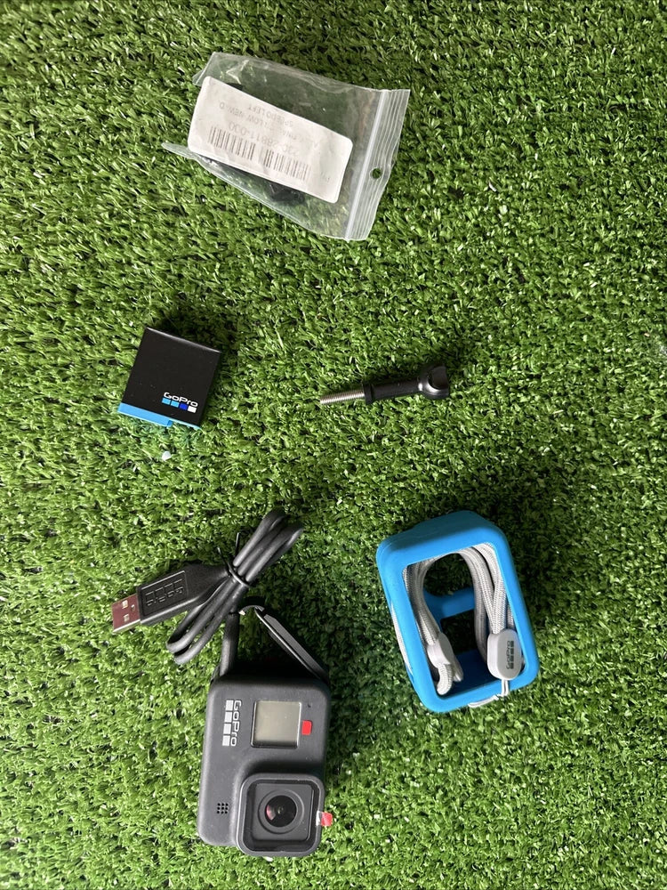 GoPro HERO8 black action camera with blue housing frame and black mounting accessories