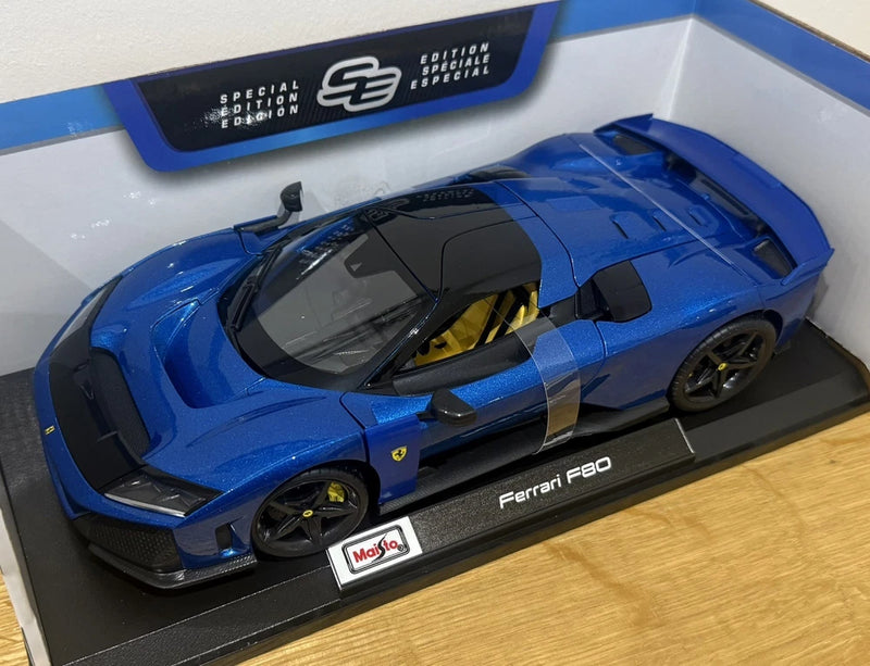 Maisto 1:18 blue die-cast Ferrari F80 model car with black hood and display base