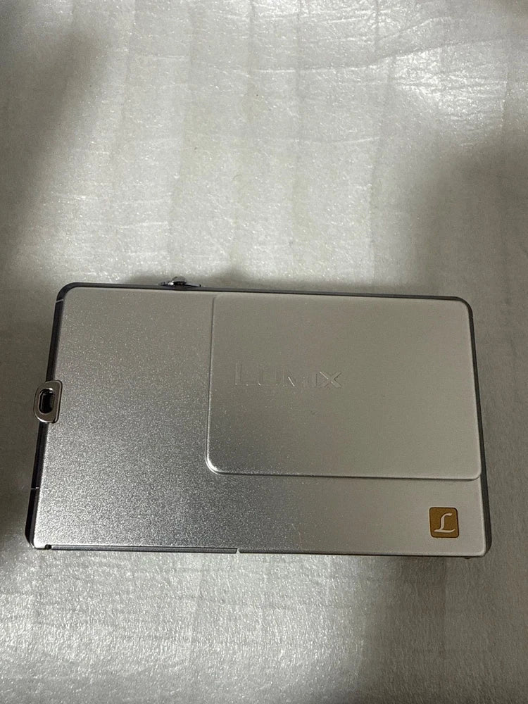 Panasonic DMC-FP1 compact digital camera, silver rear view with LCD