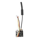 Mini FPV camera module with black PCB and attached multicolor wires