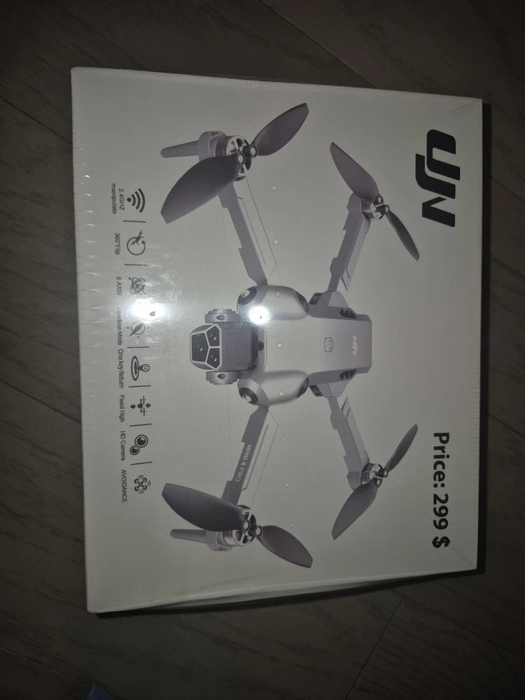 White quadcopter GPS drone with camera, shown on product box