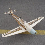 RC balsa wood airplane model kit with light gray fuselage, exposed frame, and twin wings