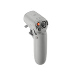 DJI drone camera control controller, gray handheld with orange trigger and twin thumb sticks
