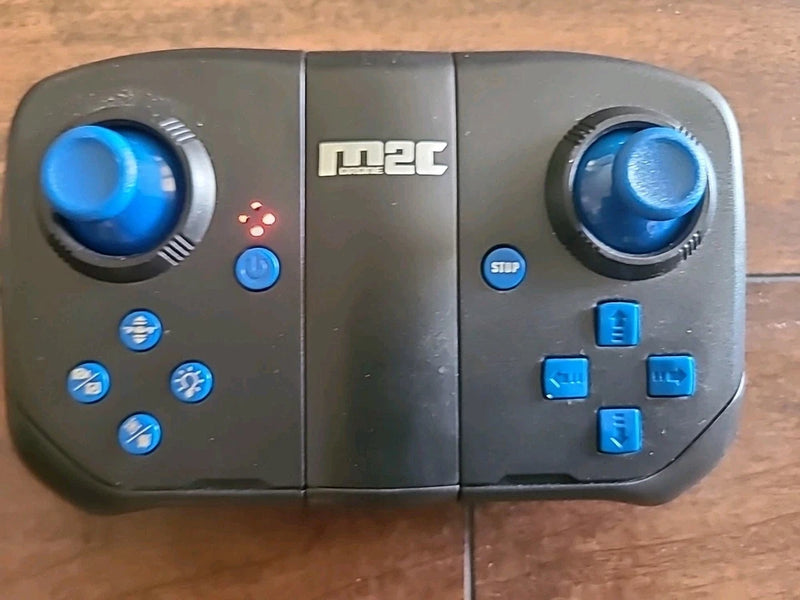 M2C mini drone remote controller with dual blue thumbsticks and button layout