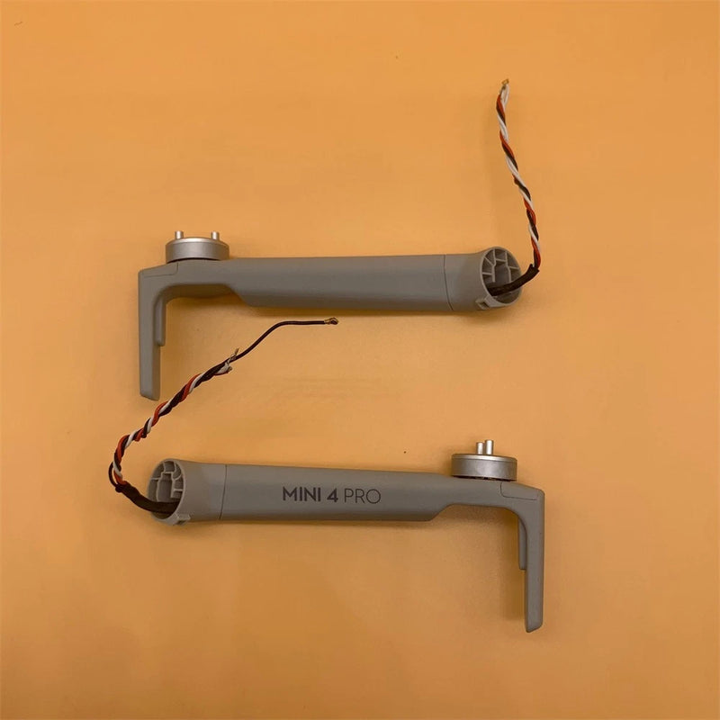 DJI Mini 4 Pro motor arm repair kit, two grey arms with wiring and mounts