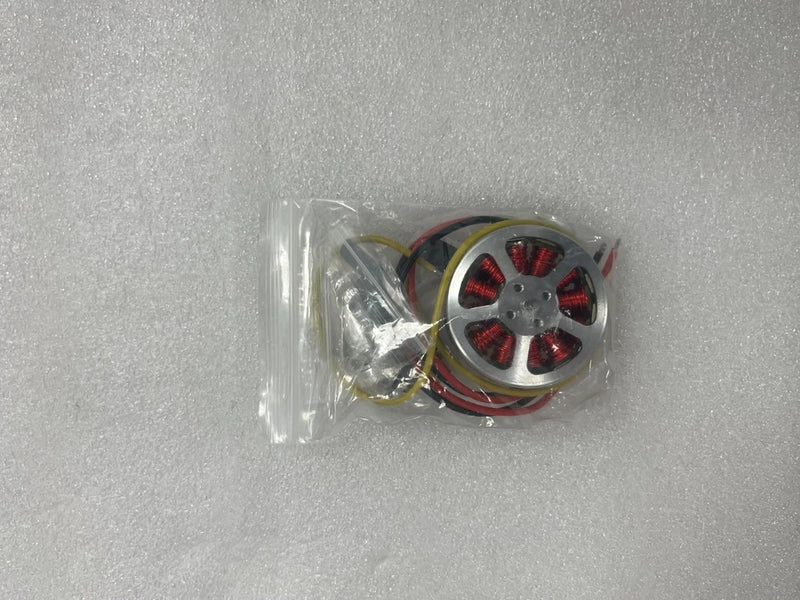 Brushless RC motor (5010) with red coil windings and wire harness in clear bag