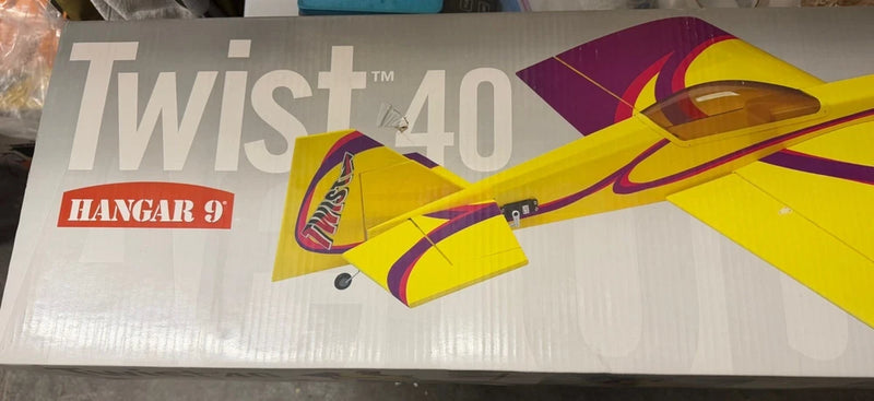 Yellow Hangar 9 Twist 40 RC aerobatic fixed-wing airplane model with colorful accents