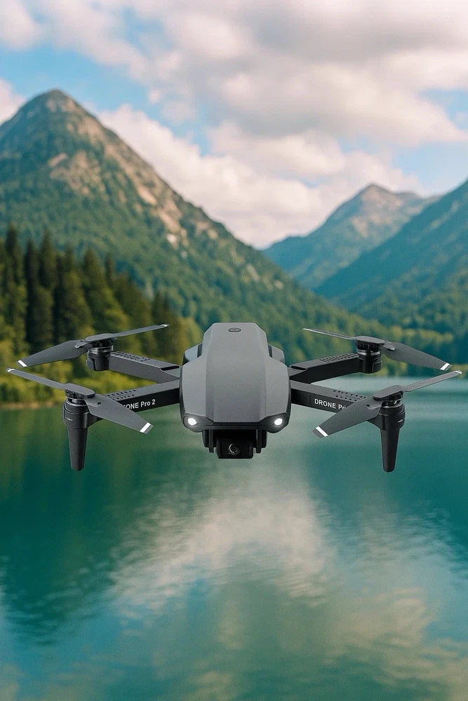 Foldable gray quadcopter drone with front camera and four black propellers