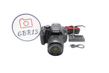 Canon 600D DSLR camera with 18–55mm lens, cables and strap, front view