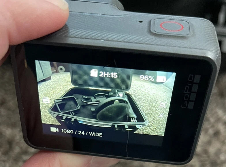 Black GoPro HERO6 action camera with front touchscreen displaying video preview