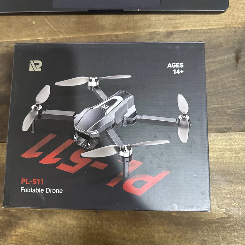 Foldable quadcopter drone box with four propellers and controller label PL-511