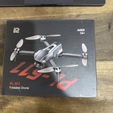 Foldable quadcopter drone box with four propellers and controller label PL-511