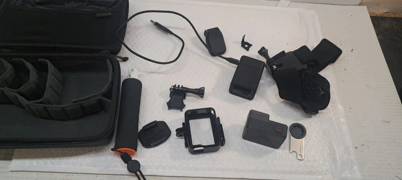 GoPro Hero action camera kit with case, mounts, and charging accessories