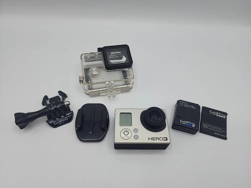 GoPro HERO3 Silver action camera with case, battery, mount, and two accessory boxes