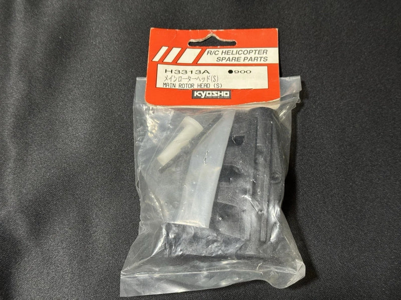 Kyosho RC helicopter main rotor head spare part in sealed plastic bag