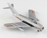 Silver-gray 1/72 jet fighter model with red Chinese markings and nose cockpit